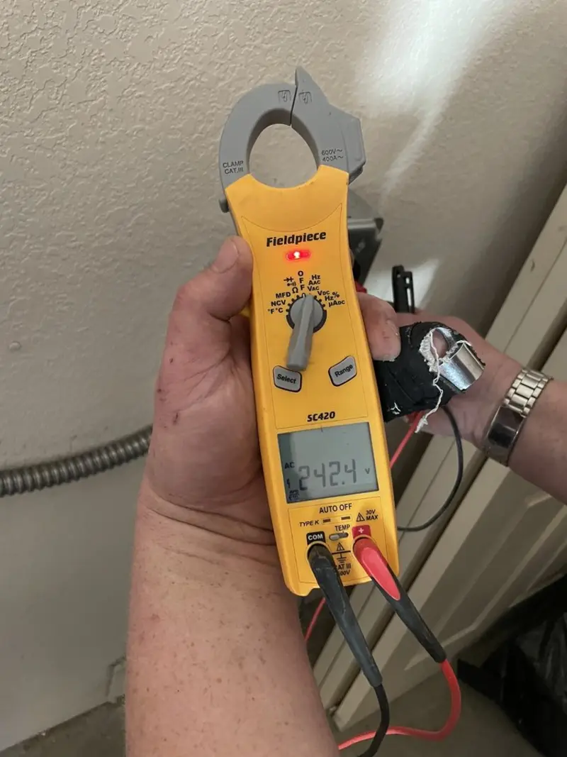 Voltage testing with clamp meter during Whole House Surge Protector in Lindenhurst